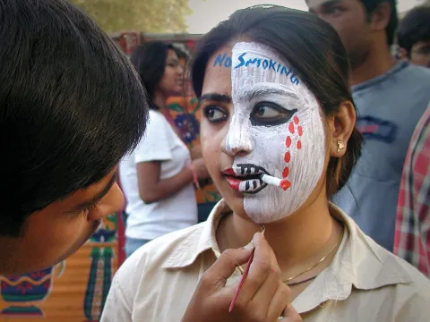 Indian girl with quit tobacco paint on face