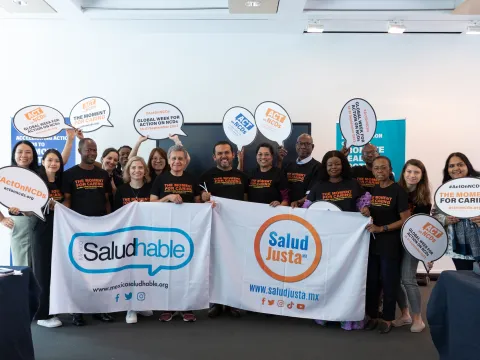NCD advocates hold Mexico Salud-Hable and Salud Justa banners at a gathering in New York, July 2023