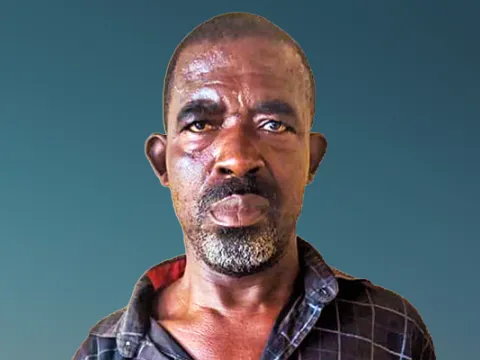 portrait of a black man smiling at camera living with NCDs