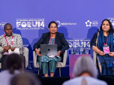 Advocates and NCDA Members on stage at Global NCDA Forum in Kigali