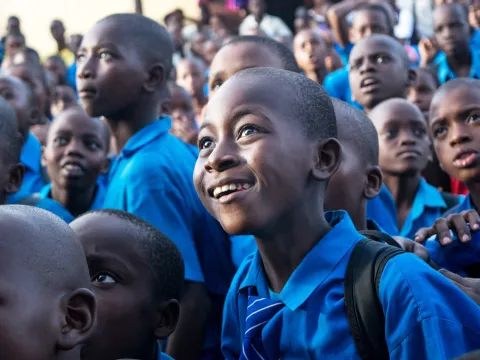 Smiling children in Africa looking up