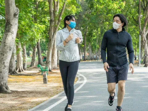 Couple running in park