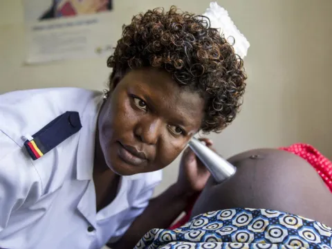 Head antenatal nurse Margie Harriet Egessa providing antenatal counseling and checkups for a group of pregnant women.