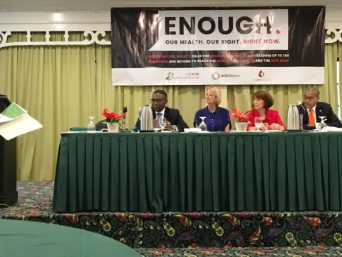 NCD Alliance Board member and Director Emeritus at PAHO, Sir George Alleyen, left, speaking at the Caribbean NCD Forum
