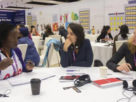 Delegates talking at NCD conference 