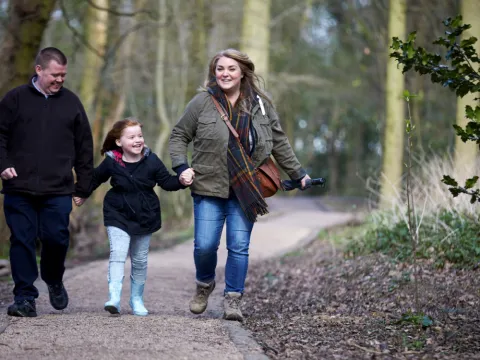 Family walking in the woods