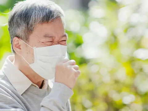 Man coughing. World TB Day