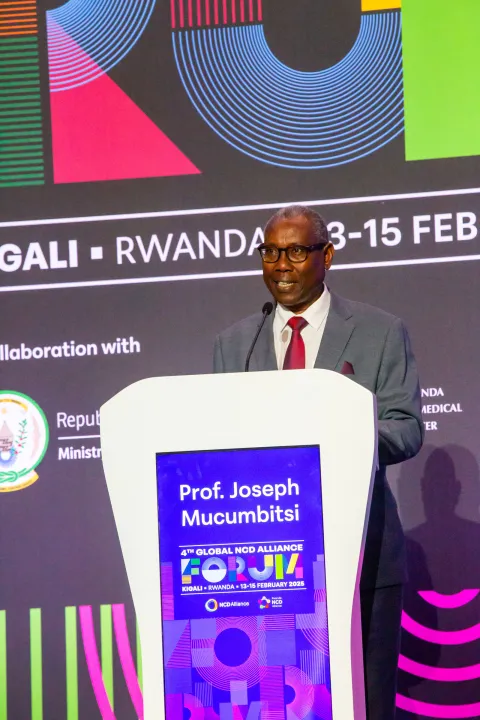 Rwanda NCD Alliance President Joseph Mucumbutsi on stage talking at Global NCD Alliance Forum