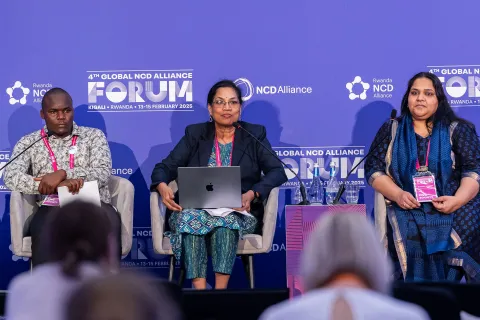 Advocates and NCDA Members on stage at Global NCDA Forum in Kigali