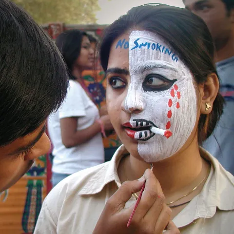 Indian girl with quit tobacco paint on face