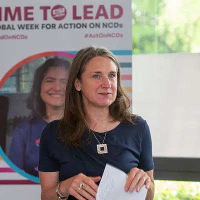 Woman Alison Cox speaking at an NCDA event