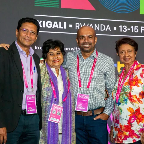 smiling people at the plenary of global ncd alliance forum