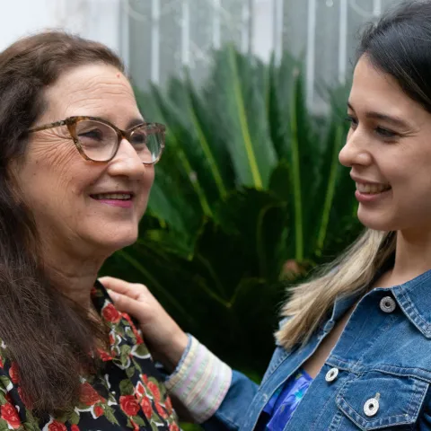 Woman living with cancer smiling with her daughter in Paraguay