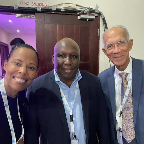 Three advocates smiling at camera in Barbados